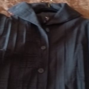 Black button down jacket can also be worn as a blouse.